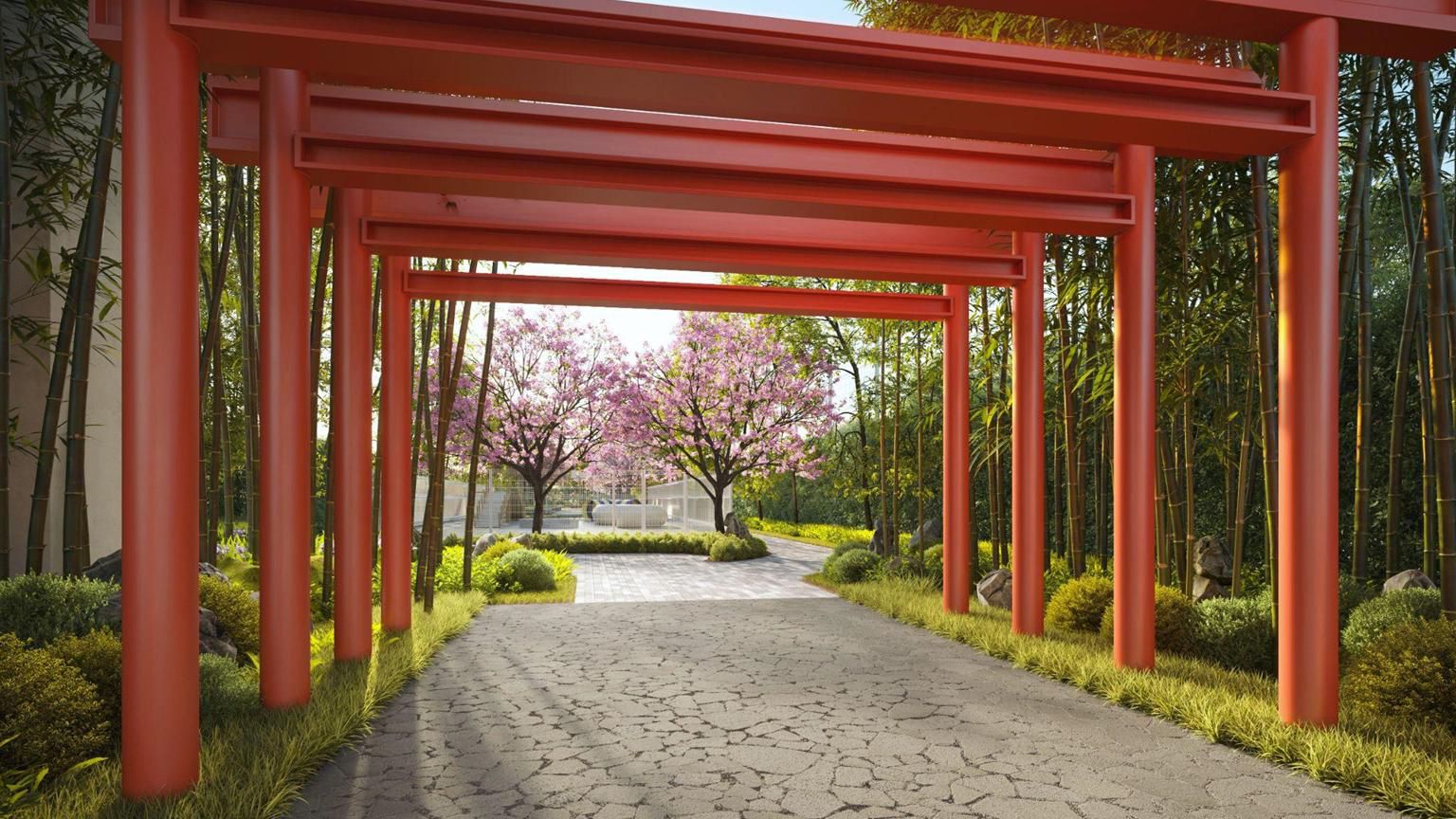 A path through a row of red torii gates between bamboo and blossom